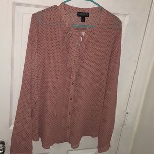 A pink polka dot blouse.